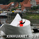Illustration for article titled Giant Paper Boat Made from Tetrabriks, Allows Real Sailors on Board